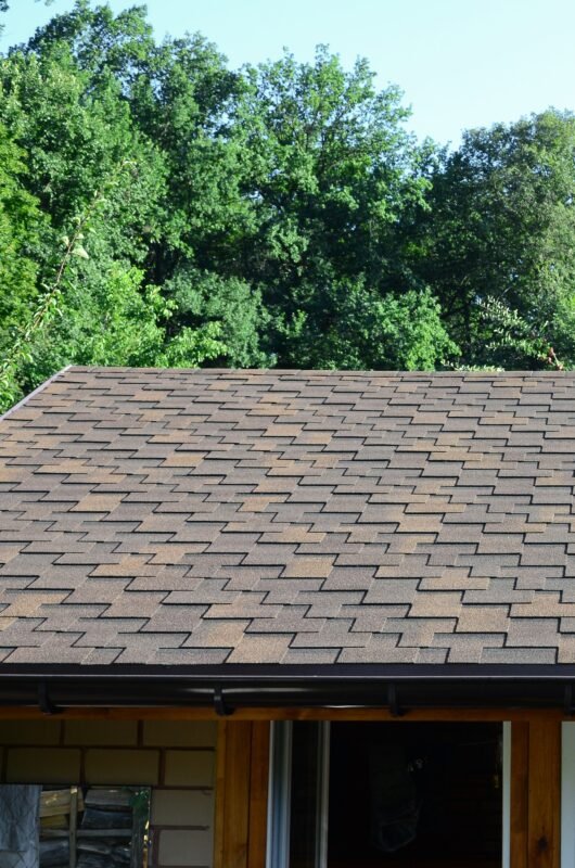 Modern roofing and decoration of chimneys. Flexible bitumen or slate shingles